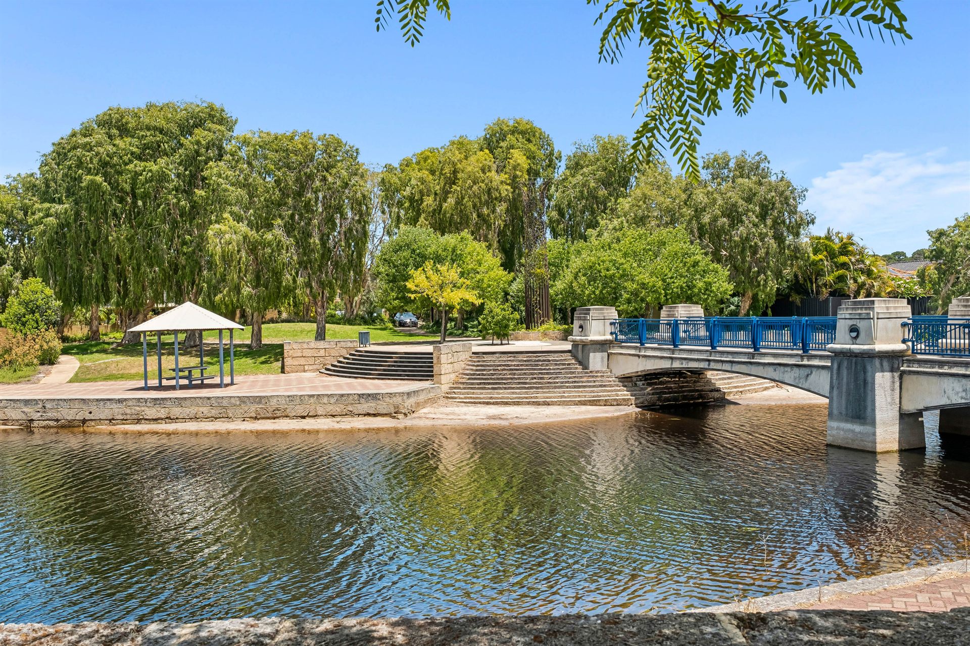Bridge over the lake in a landscaped Ellenbrook park